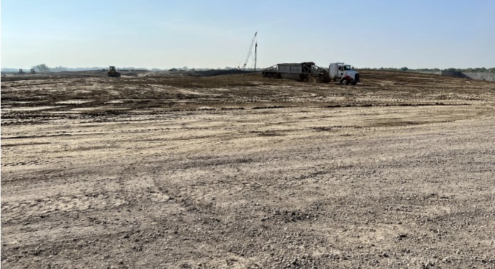 The construction site is just outside of North Platte, Nebraska. It was previously an old sewer lagoon, complete with marshy soil and cattails.