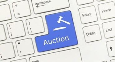 Buyers make John Deere tractor top item at equipment auction