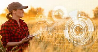 Woman with tablet in field