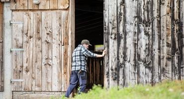Farmer entering barn