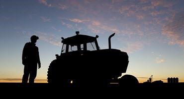 Farmer in sunset