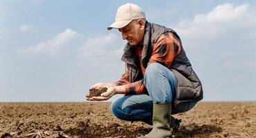 Farmer holding soil