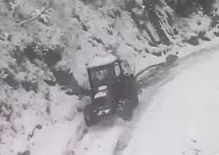 Tractor Slides Down Icy Hill