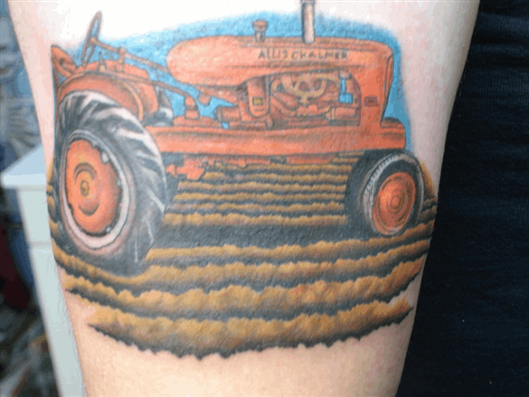 pasturetattoo ✨ Pictured is a figures side upper thigh with a fresh tattoo  of a commercially nondescript green tractor with a negative… | Instagram