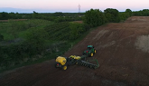 John Deere 9420R pulling a 24 row corn planter in Southern Ontario