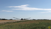 Farming In Saskatchewan: Spraying Wheat John Deere R4045