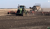 Pulling big drill with John Deere 9570RX 4wd tractor in Saskatchewan