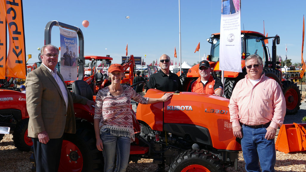 Julie Hollars receives her Kubota tractor