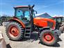 Kubota M135GX cab tractor with front and rear weights